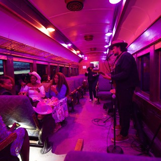 Live Music Performance Inside Illuminated Train Car
