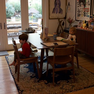 Children at Homework Table During Christmas Season