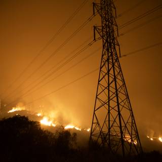 Flames Engulf Power Lines During Wildfire