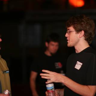 Two Men Enjoying Drinks and Conversation at BarCamp 2006