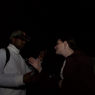 Animated Conversation Between Two People at Night Event