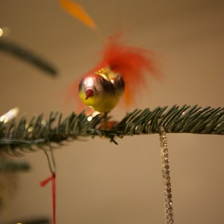 Vintage Glass Bird Ornament on Evergreen Branch