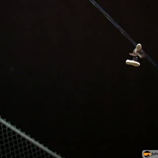 A Tennis Racket Hangs Loose