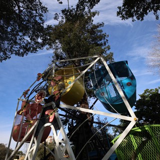 Children Enjoying Colorful Ferris Wheel at Dusk