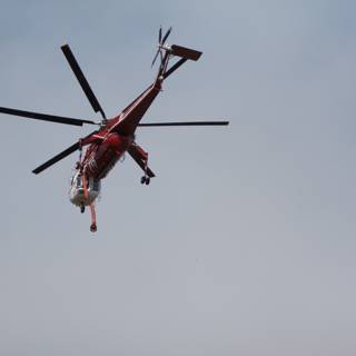 Red Helicopter in Flight
