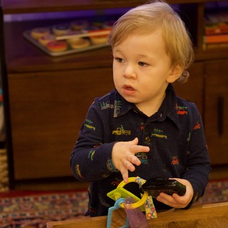 Toddler Playing with Toys on Christmas Eve