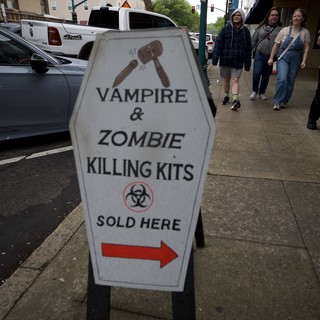 Vampire & Zombie Killing Kits Sign on Small Town Street