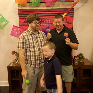 Friends Shake Maracas at Mexican Fiesta Anniversary Party