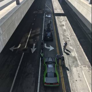 Parked Green Car Under LA Bridge