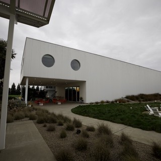 Modern Winery Architecture Under Cloudy Skies