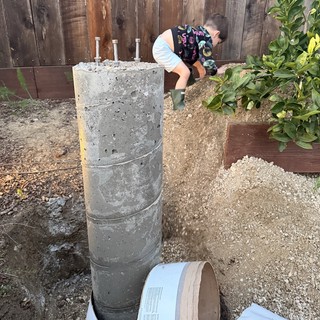 Concrete Pier Foundation with Anchor Bolts in Backyard