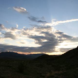 Desert Sunset with Clouds and Mountains