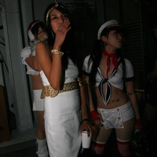 Women in Costumes with Cigarettes