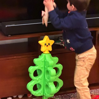 Toddler Playing Interactive Christmas Tree Game at Home