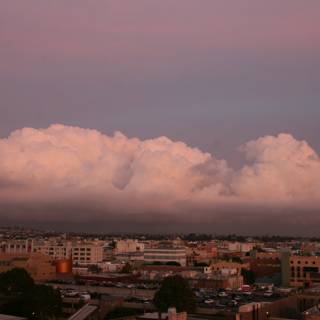 Pink Cumulus Cloud over Urban Landscape