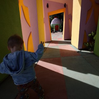 Child Exploring Colorful Architecture at Fantasyland