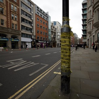 Electric Cable Warning Sign on Urban Street Pole