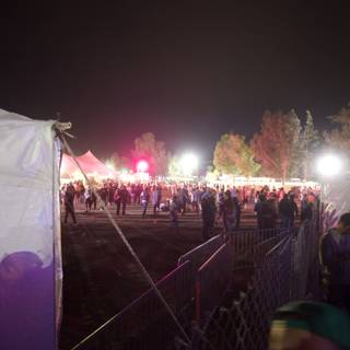 Nighttime Crowd in a Festival Tent