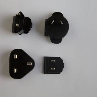 Trio of Black Plugs with White Background