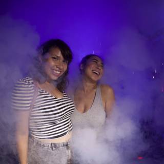 Two Women Smiling through the Smoke