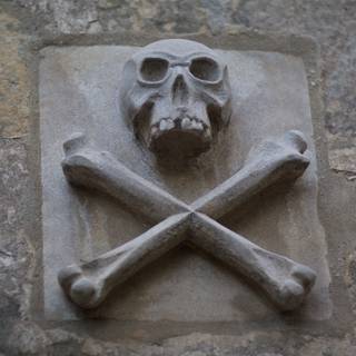 Archaeological Discoveries: Skull and Crossbones on Mission Wall