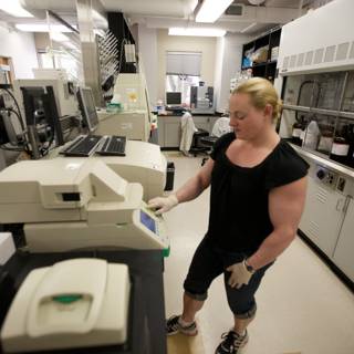 Woman Working on Lab Machine