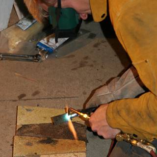 Man welding wood