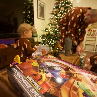 Christmas Morning Unwrapping Presents with Family