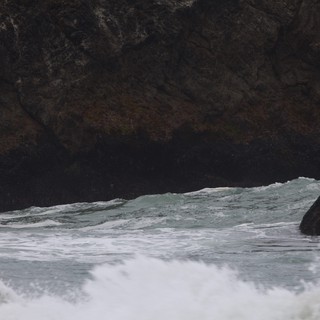 Waves Crashing Through Sea Cave Rocky Cove