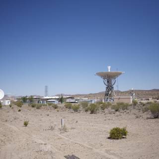Radio Telescope and Antenna Tower in the Desert