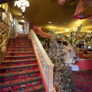 Whimsical Christmas Decorated Interior with Ornate Staircase