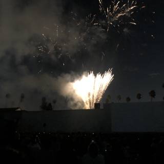Spectacular Fireworks Display Lights up the Night Sky Above a Crowded Outdoor Venue