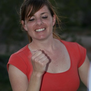 Triumphant Woman Celebrates Victory with Fist Pump