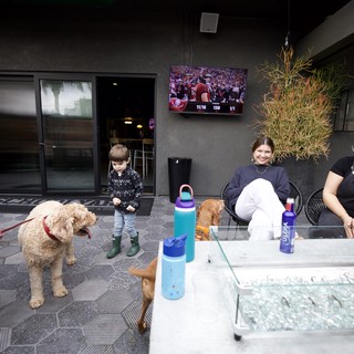 Family Gathering at Modern Outdoor Patio with Pet Dog