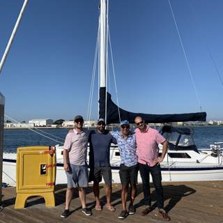 Four Men and their Sailboat at the Waterfront