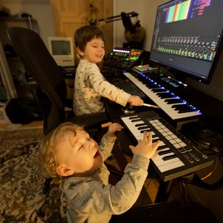 Young Brothers Making Music Together in Home Studio