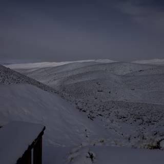 Midnight View of Snowy Mountain Range