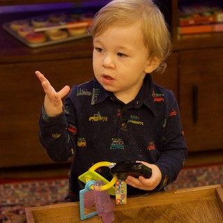 Toddler Playing with Toy Cars at Christmas Time