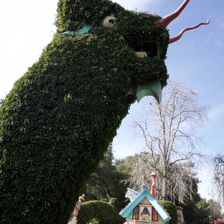 Ivy-Covered Dragon Topiary Looms Over Fantasyland