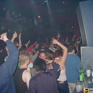 Nightclub Party with Upraised Hands