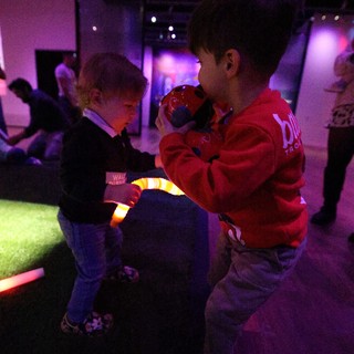 Children Playing at Baby Rave Under Purple Lights
