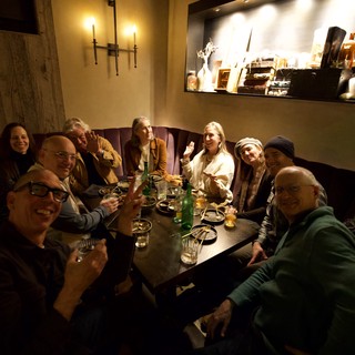 Friends Gathering at Intimate Restaurant Dinner