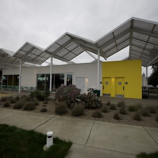 Modern Restaurant with Distinctive Zigzag Solar Canopy