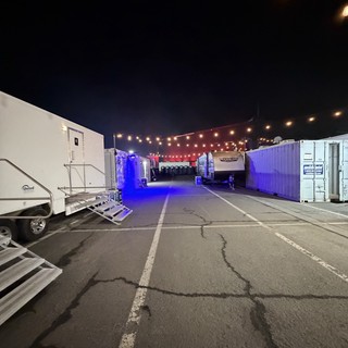 Concert Venue Setup at Dawn with String Lights