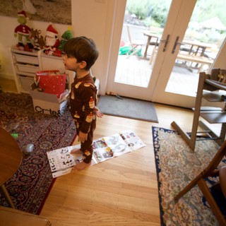 Christmas Morning Joy: Child Opening Presents