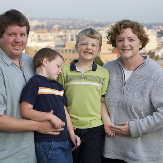 Family Portrait on Urban Rooftop at Dusk