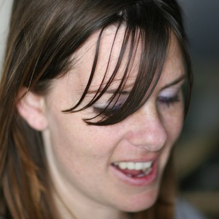 Candid Smile of a Young Woman with Freckles