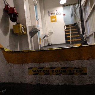 Watch Your Step Warning on USS Hornet Naval Vessel