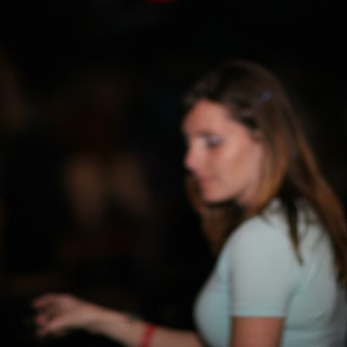 Young Woman Lost in Thought at Nightclub
