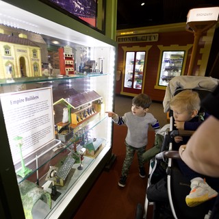 Young Visitors Explore Model Train Display at Museum